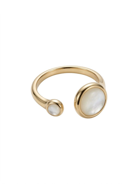 Gold open cuff ring with mother-of-pearl oval and round inlays, shown on a plain white background.