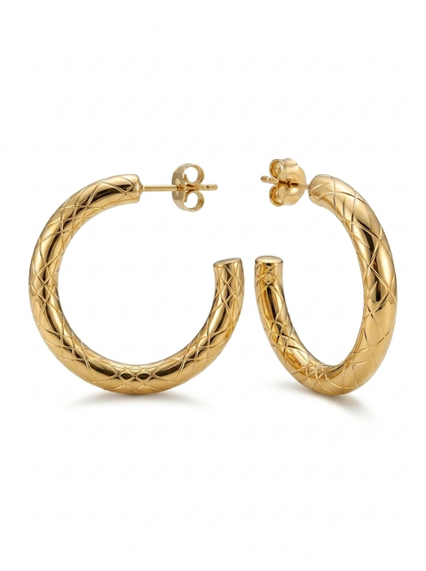 A pair of textured gold hoop earrings with a diamond-patterned woven design, displayed on a clean white background.