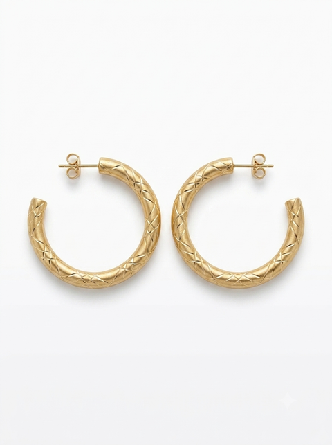 A pair of textured gold hoop earrings with a braided cable pattern, displayed on a clean white background.