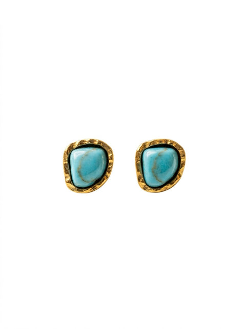 A pair of gold stud earrings featuring organic-shaped turquoise blue stones in a textured bezel setting, shown on a plain white background.