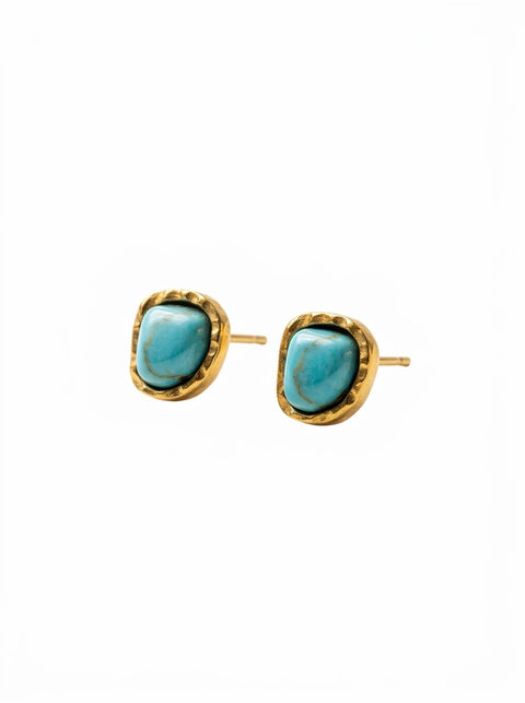 A pair of gold stud earrings featuring organic-shaped turquoise blue stones in a textured bezel setting, shown on a plain white background.