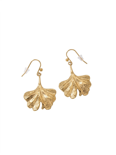 A pair of gold-tone dangle earrings shaped like textured ginkgo leaves, shown on a plain white background.