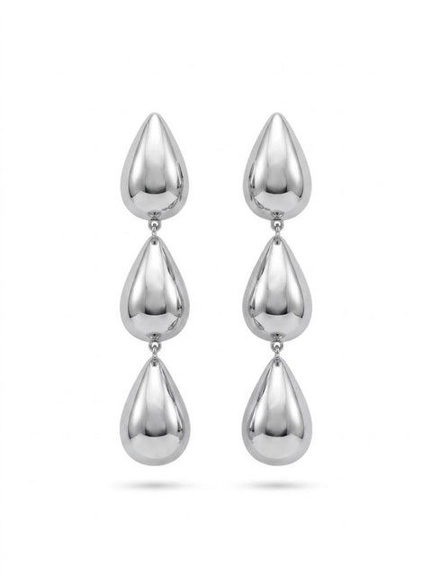 A pair of silver drop earrings with three polished teardrop-shaped beads hanging vertically on each earring, shown against a plain white background.